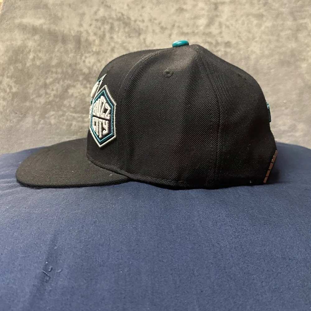 PRO Brand Charlotte Hornets Multi-Logo SnapBack Hat.